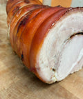 Roasted porchetta, sliced to show the rolled center